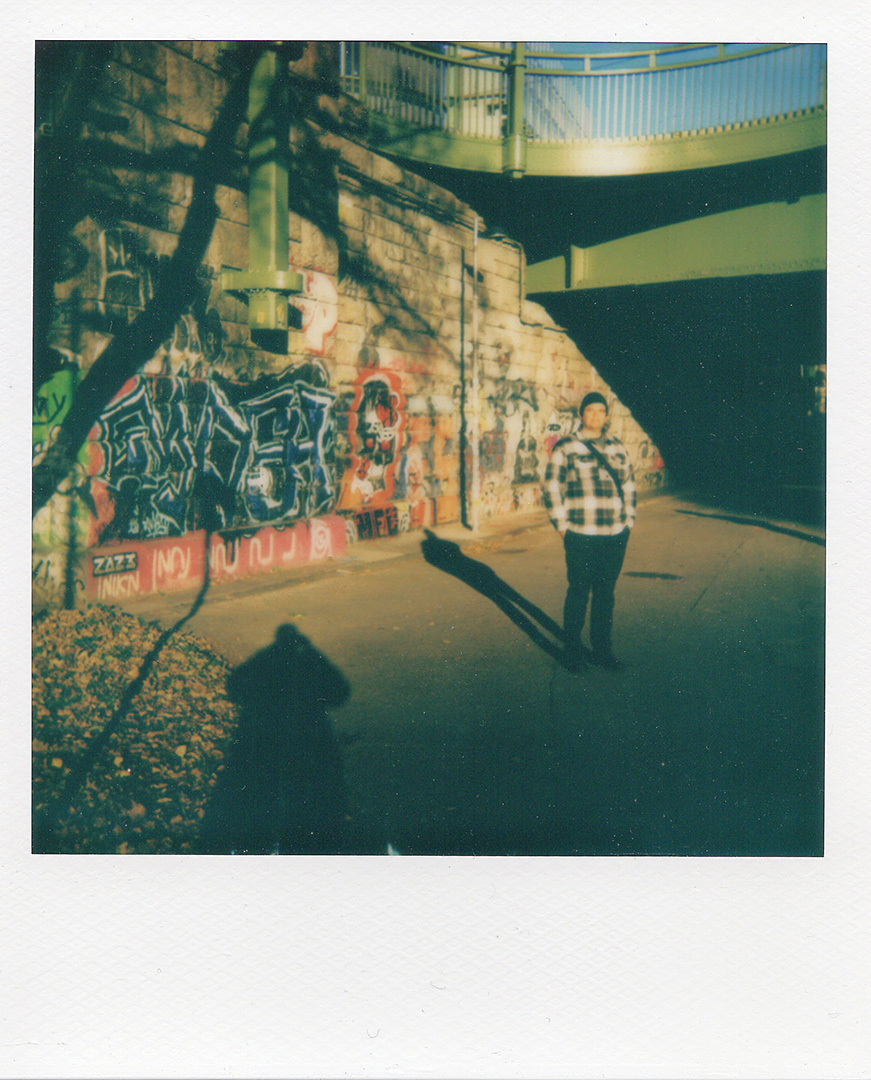 a polaroid picture of Koen Smet shot by Bart Smet at the Donaukanal in Vienna on a sunny autumn day.
